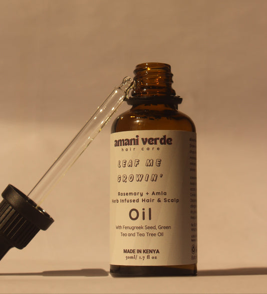 Bottle of Amani Verde oil with dropper on a white background