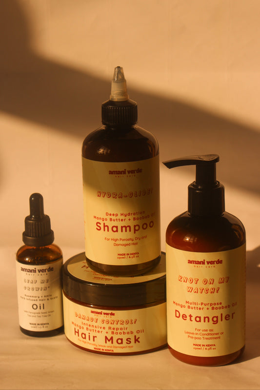 Set of hair care products including shampoo, conditioner, mask, and oil on a beige background